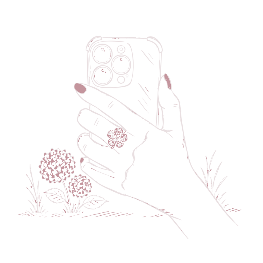 Pink and white illustration of a hand holding a smartphone with a floral ring